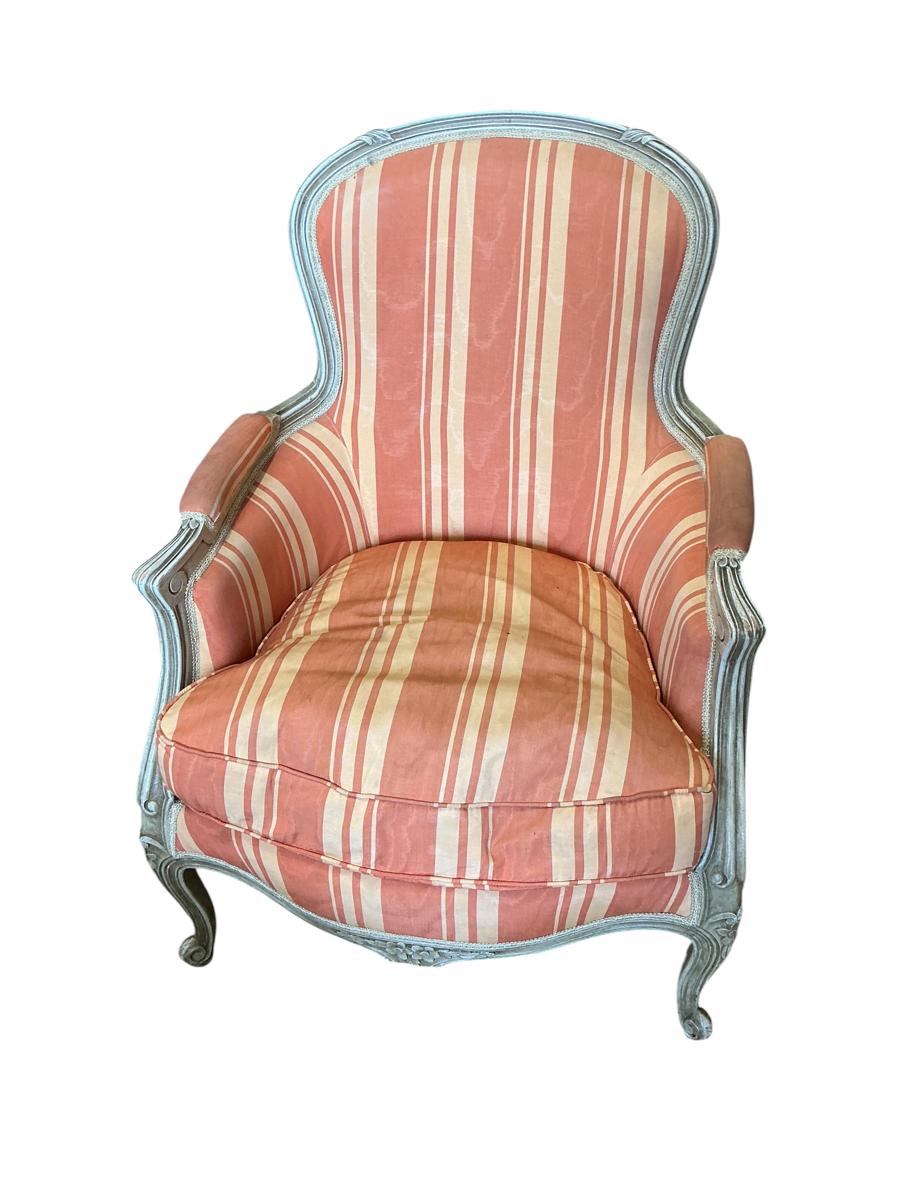A pair of Louis XVI style painted upholstered armchairs, width 66cm, depth 60cm, height 88cm